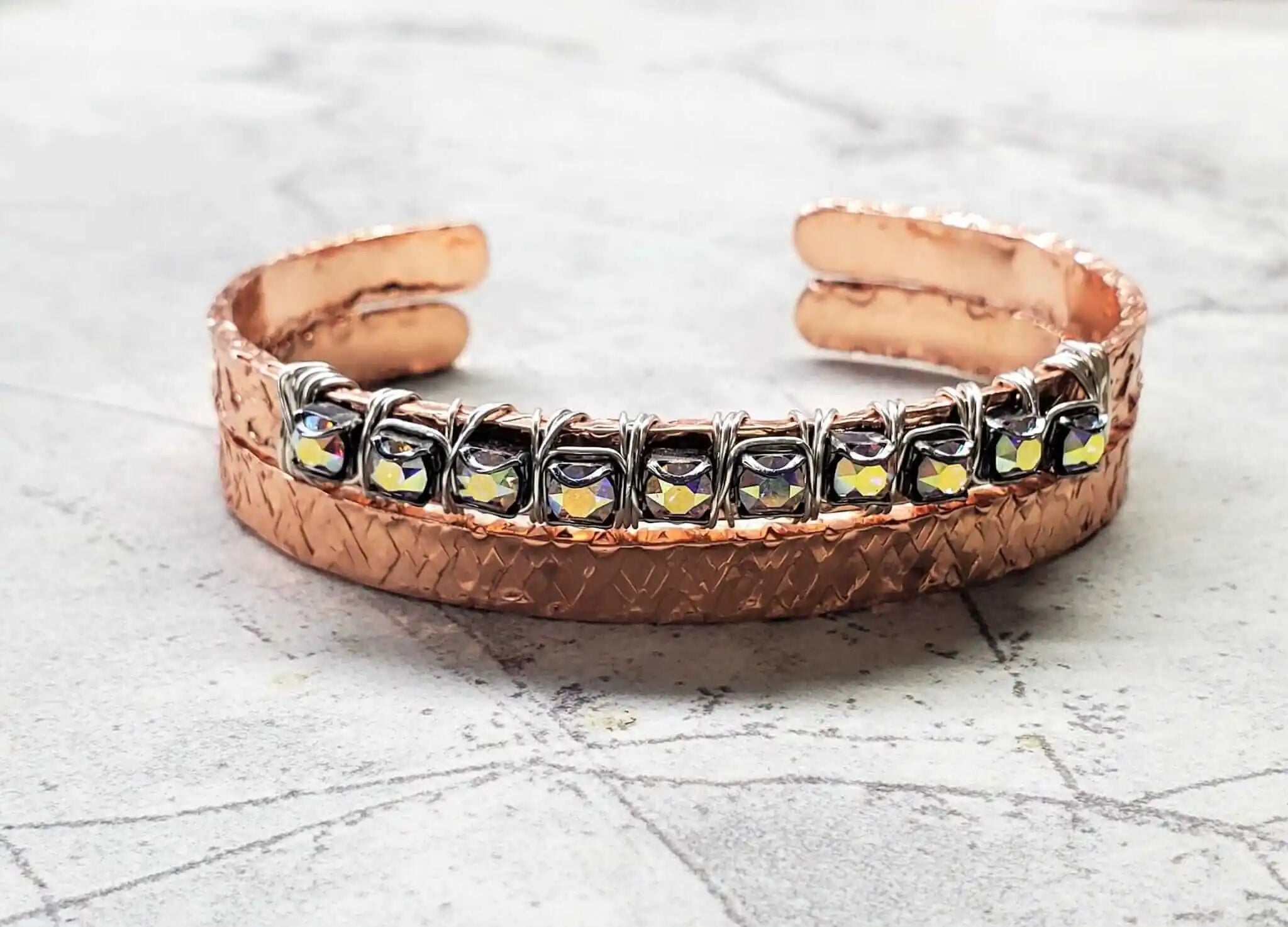 Elevate Your Style with the Dazzling Silver Wire Wrapped Crystal Textured Copper Cuff Set